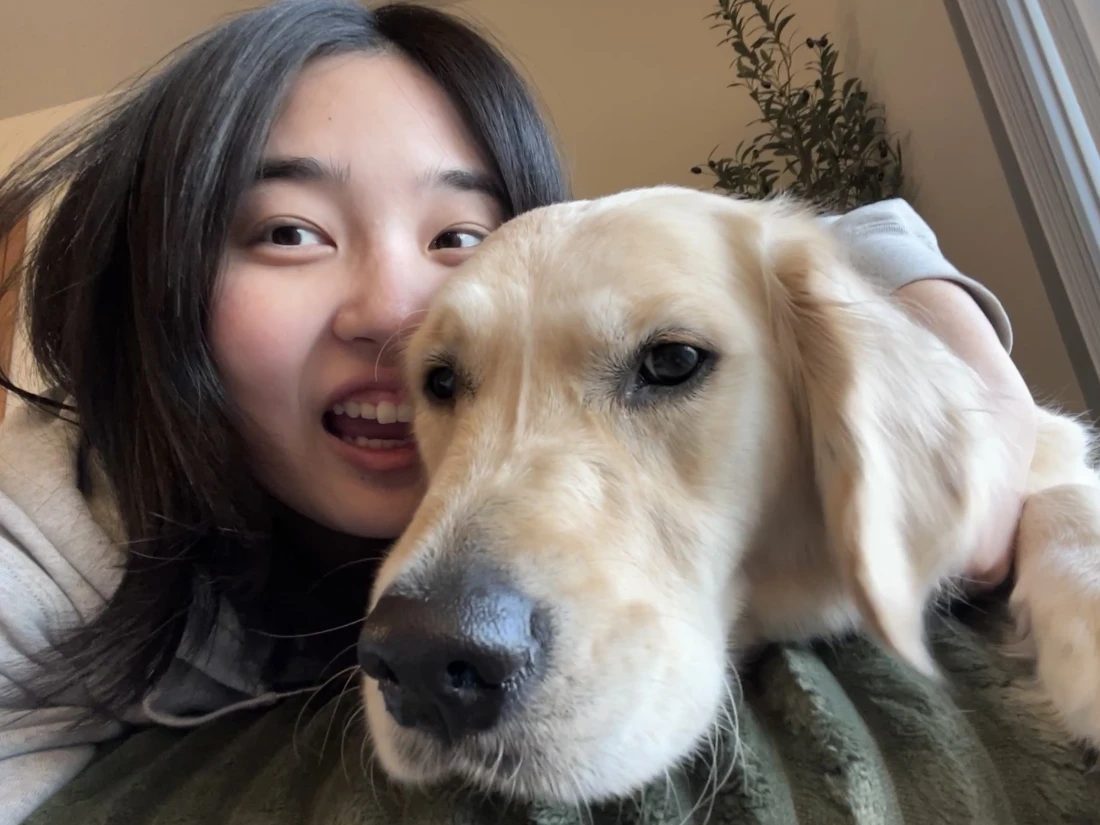 Cindy with her golden retriever, Pupu